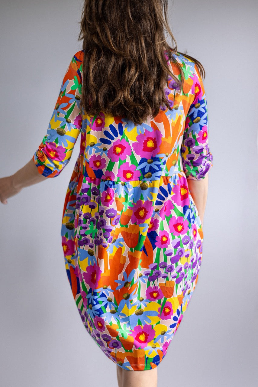 Back view of the FOKE REN Dress in Bloomcore, a relaxed cotton jersey dress with an all-over floral print.