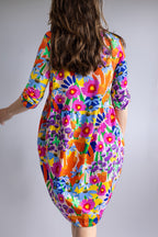 Back view of the FOKE REN Dress in Bloomcore, a relaxed cotton jersey dress with an all-over floral print.